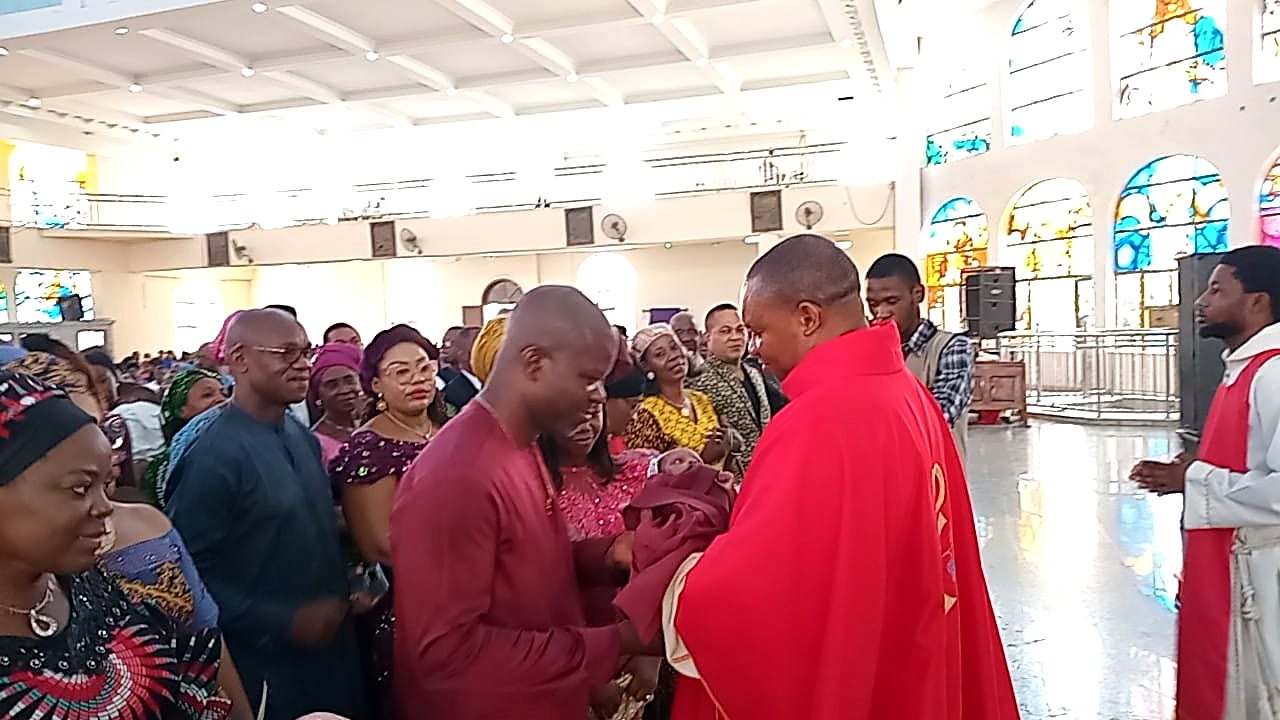 A child presented for blessing after Mass.